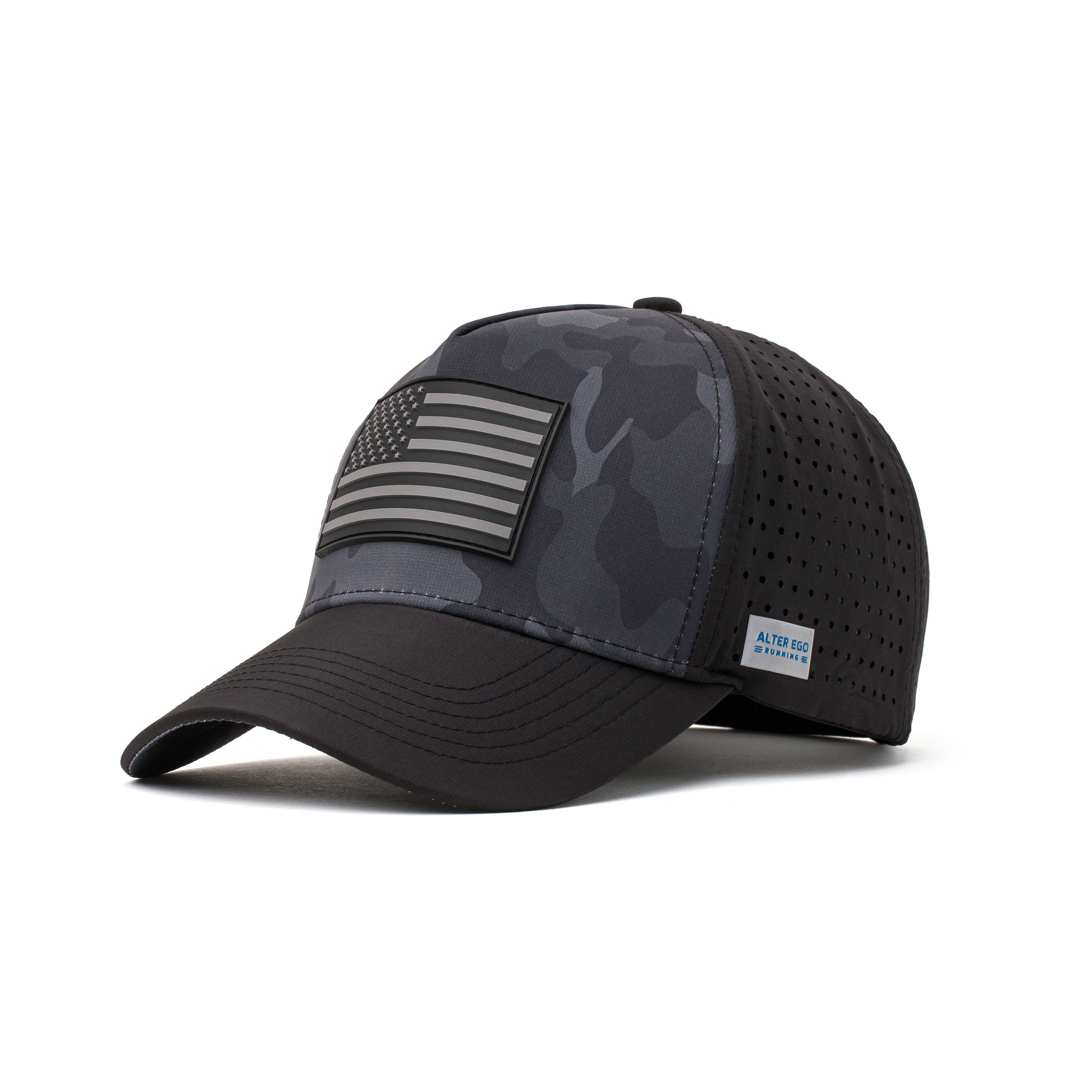 Angled view of a black performance hat showcasing a dark camo design, black flag logo patch, and a curved brim for added style and functionality
