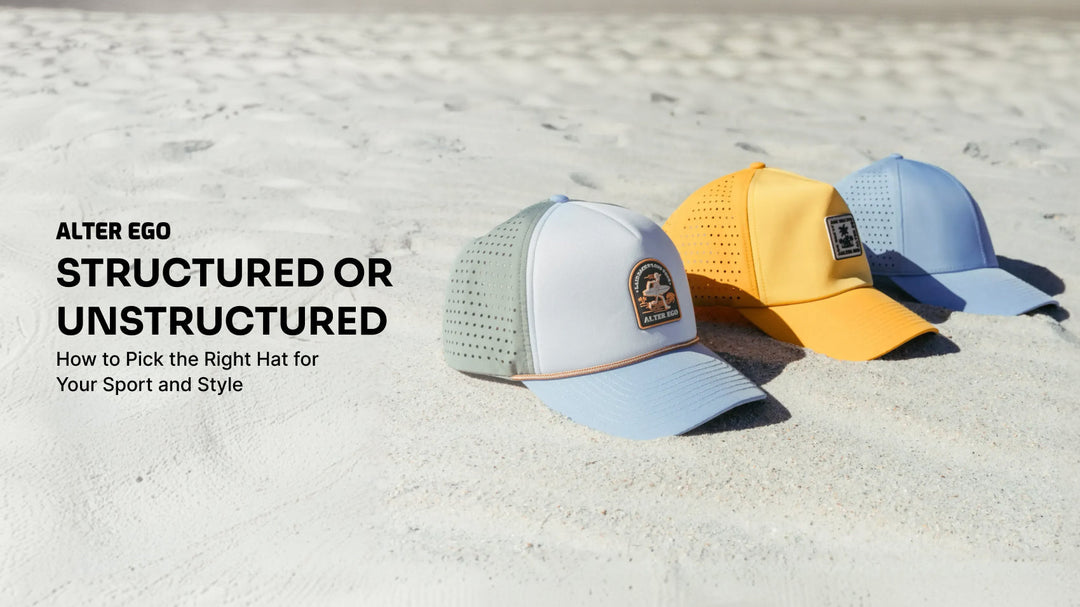 Alter Ego structured and unstructured performance hats displayed on a sandy beach