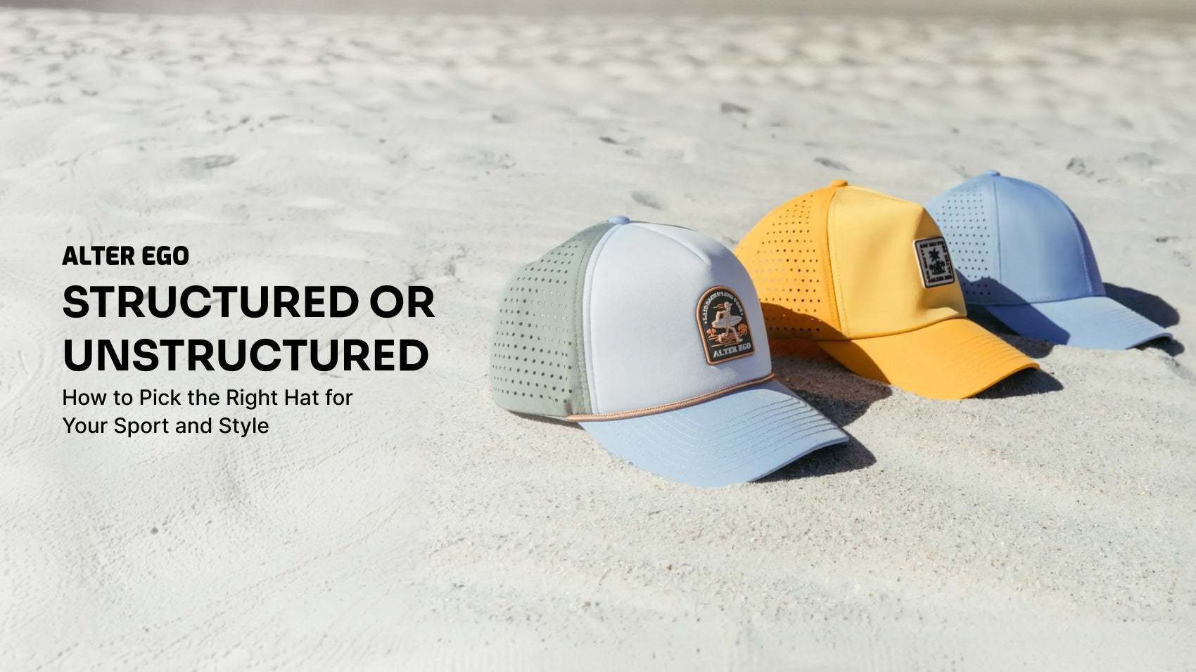 Alter Ego structured and unstructured performance hats displayed on a sandy beach