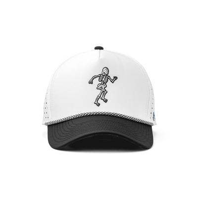 Front view of a white and black athletic hat with a bold skeleton design, lightweight construction, and sweat-wicking fabric for performance.