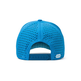 Back view of a blue golf performance hat with an adjustable strap and breathable light blue mesh panel for comfort during outdoor activities.