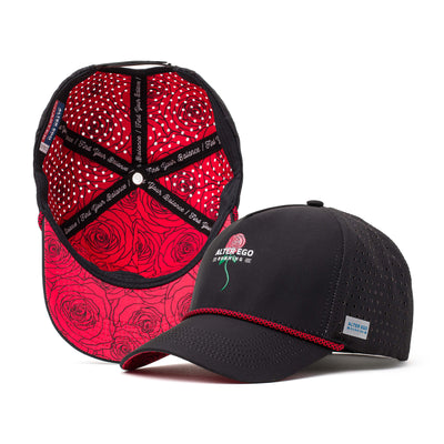 Black performance hat with a red rose design on the front and a vibrant red patterned mesh back, perfect for outdoor wear and athletic activities.