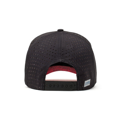 Back view of a black performance hat with red patterned mesh and an adjustable strap, offering breathability and a secure fit.