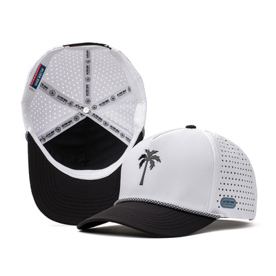 White performance hat with a black palm tree logo on the front and breathable white perforated mesh back, designed for active wear and outdoor adventures.