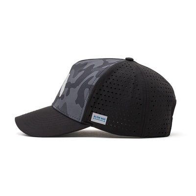 Side view of a black hat featuring a dark camo pattern, black flag logo patch, and lightweight construction, ideal for active and casual wear.