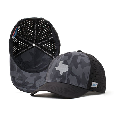 Black performance hat with a dark camo design and a white Texas state patch on the front, paired with a breathable perforated mesh back for outdoor and athletic activities.