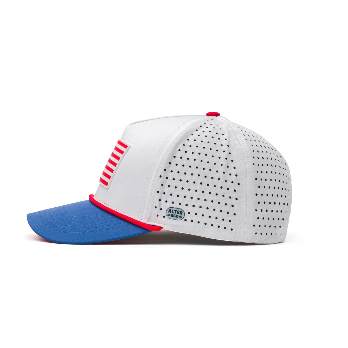 Side view of the Coaster Splash White USA Flag performance hat with a raised American flag patch, blue curved brim, laser-cut perforated side panels, and tonal side badge.