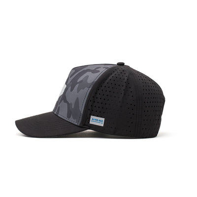 Side view of a black and camo hat featuring a white Texas state patch, lightweight fabric, and a curved brim for active and casual wear.