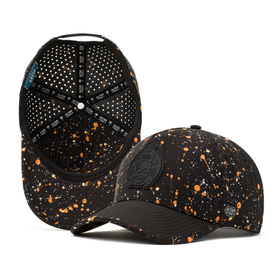 Alter Ego Coaster Splash Dark Splatter hat featuring a black base with orange and white splatter detailing, black brim, laser cut ventilation panels, reflective Alter Ego logo patch, and matching splatter pattern under the brim.