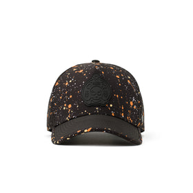 Alter Ego Coaster Splash Dark Splatter hat shown from the front, featuring a black base with orange and white splatter detailing, black brim, and black skull and crossbones patch.