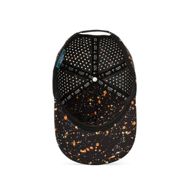 Alter Ego Coaster Splash Dark Splatter hat shown from the underside, featuring a black base with orange and white splatter detailing, black brim, laser cut ventilation panels, and branded interior detailing.