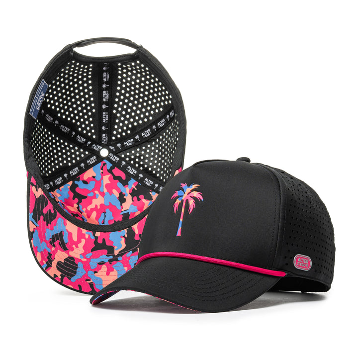 Alter Ego Coaster Splash Tropic Night Camo Palm black running hat with pink, blue, and coral camo under-bill, pink rope detail, colorful palm graphic, pink Alter Ego branding patch, and laser-cut side panels, shown from front and interior views.