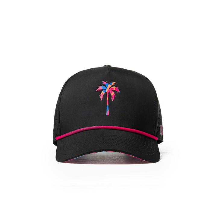Alter Ego Coaster Splash Tropic Night Camo Palm black running hat with pink, blue, and coral palm graphic, pink rope detail, pink Alter Ego branding patch, and laser-cut side panels, shown from front view.