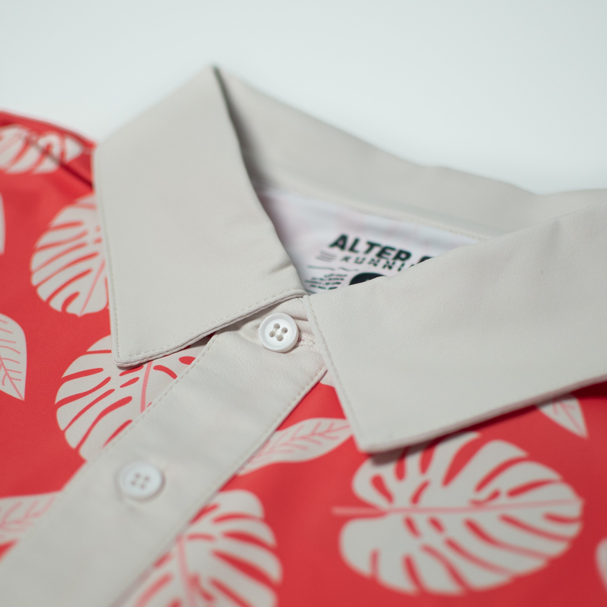 Performance Polo Palm Print Coral