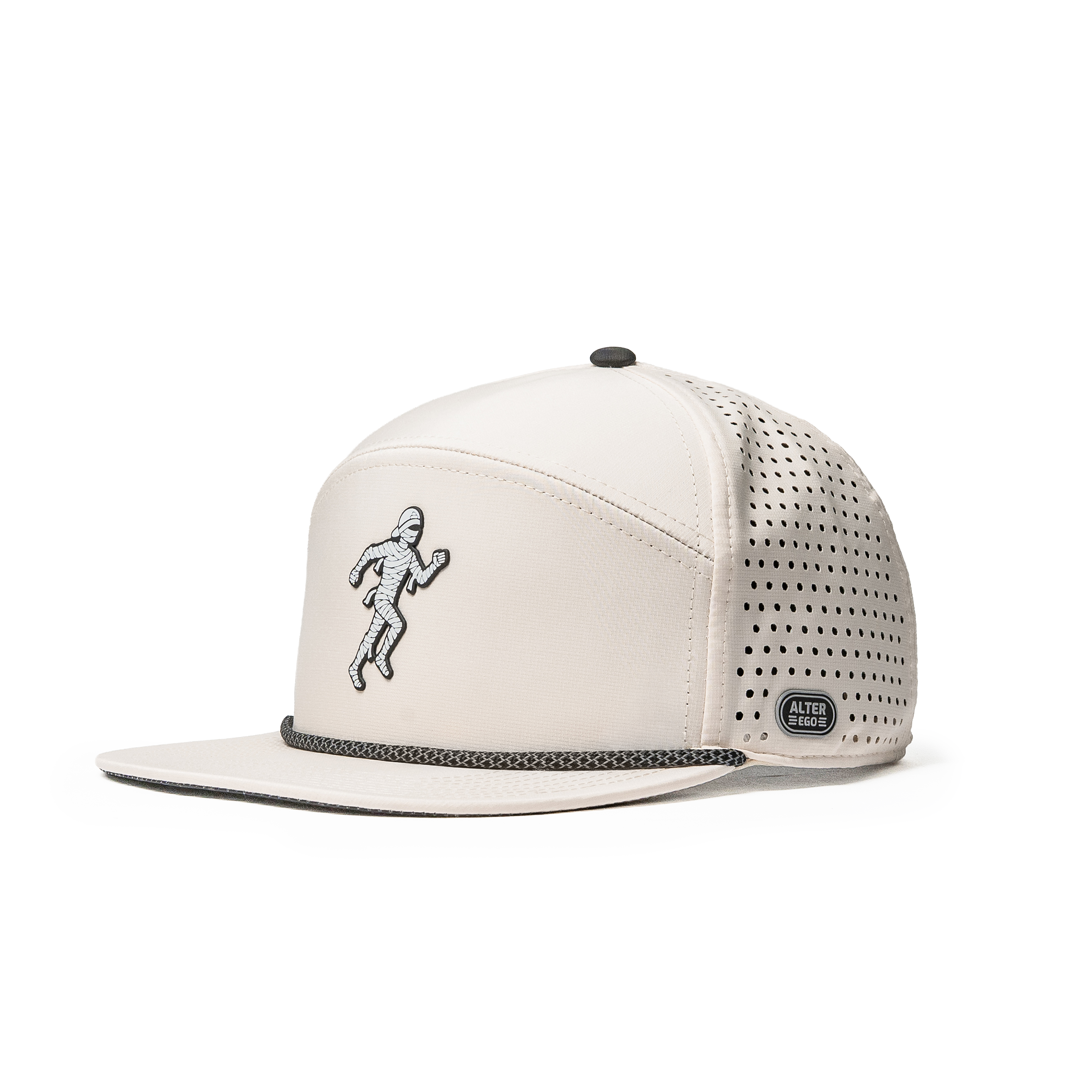 Three-quarter view of the Drifter Splash Ivory Mummy hat featuring a flat bill, ivory crown, black patterned rope detail, embroidered mummy design, and laser-cut side panels.