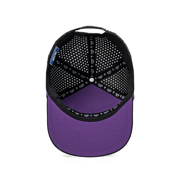 Inside view of the Drifter Splash Toxic Storm performance hat showing the black branded interior lining and purple underside of the flat bill.