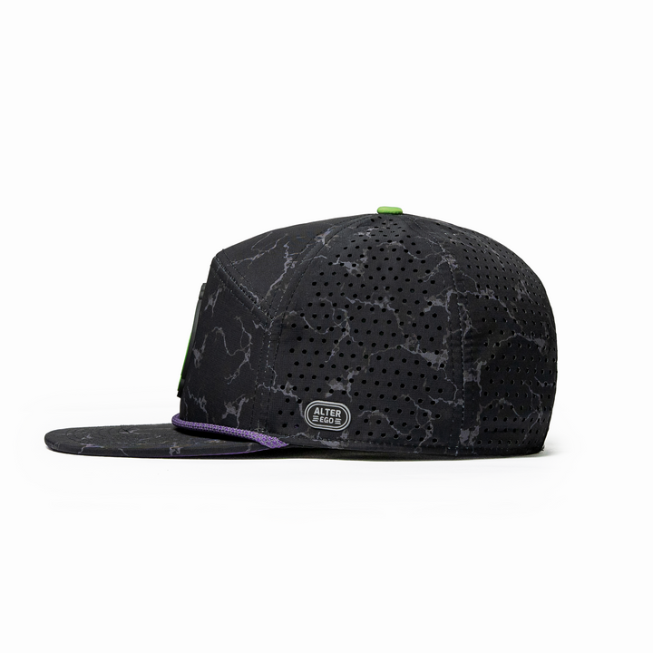 Side view of the Drifter Splash Toxic Storm performance hat featuring a black lightning pattern, flat bill, purple accent rope, and laser-cut side panels.